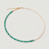 green aventurine and pearl beaded necklace in gold, with one half strung with pearls and the other half with faceted green aventurine beads in fresh green tones.