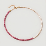  Rose quartz and pearl beaded necklace in gold, with one half strung with imitation pearl rice beads and the other half with faceted rose quartz beads graduating from soft blush to deep pink.