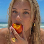UGC photo of a young female wearing gold plated jewellery at the beach