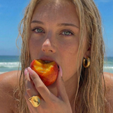 UGC photo of a young female wearing gold plated jewellery at the beach
