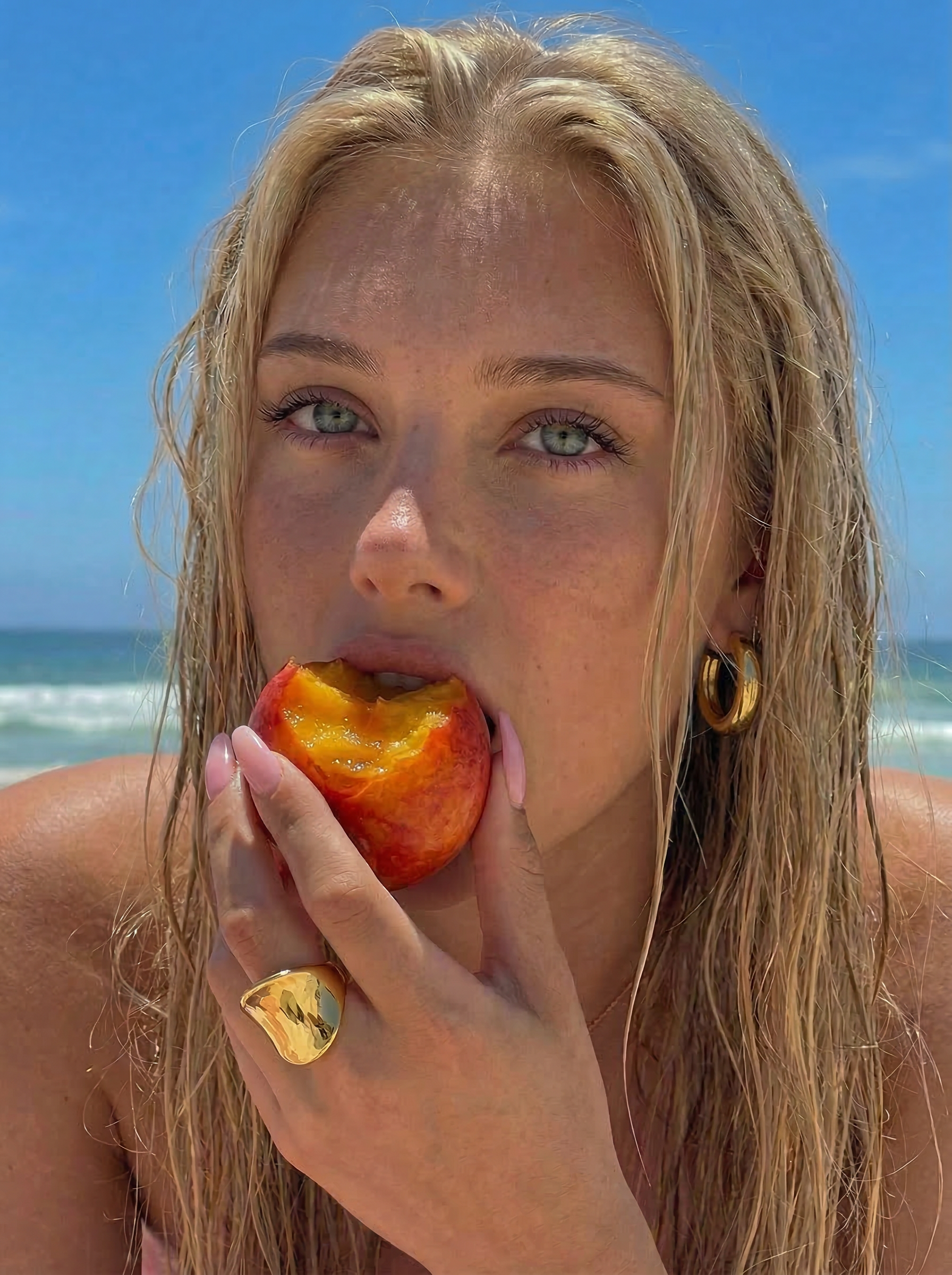 UGC photo of a young female wearing gold plated jewellery at the beach
