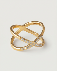 A gold ring with two intersecting bands and small stones set along one band.