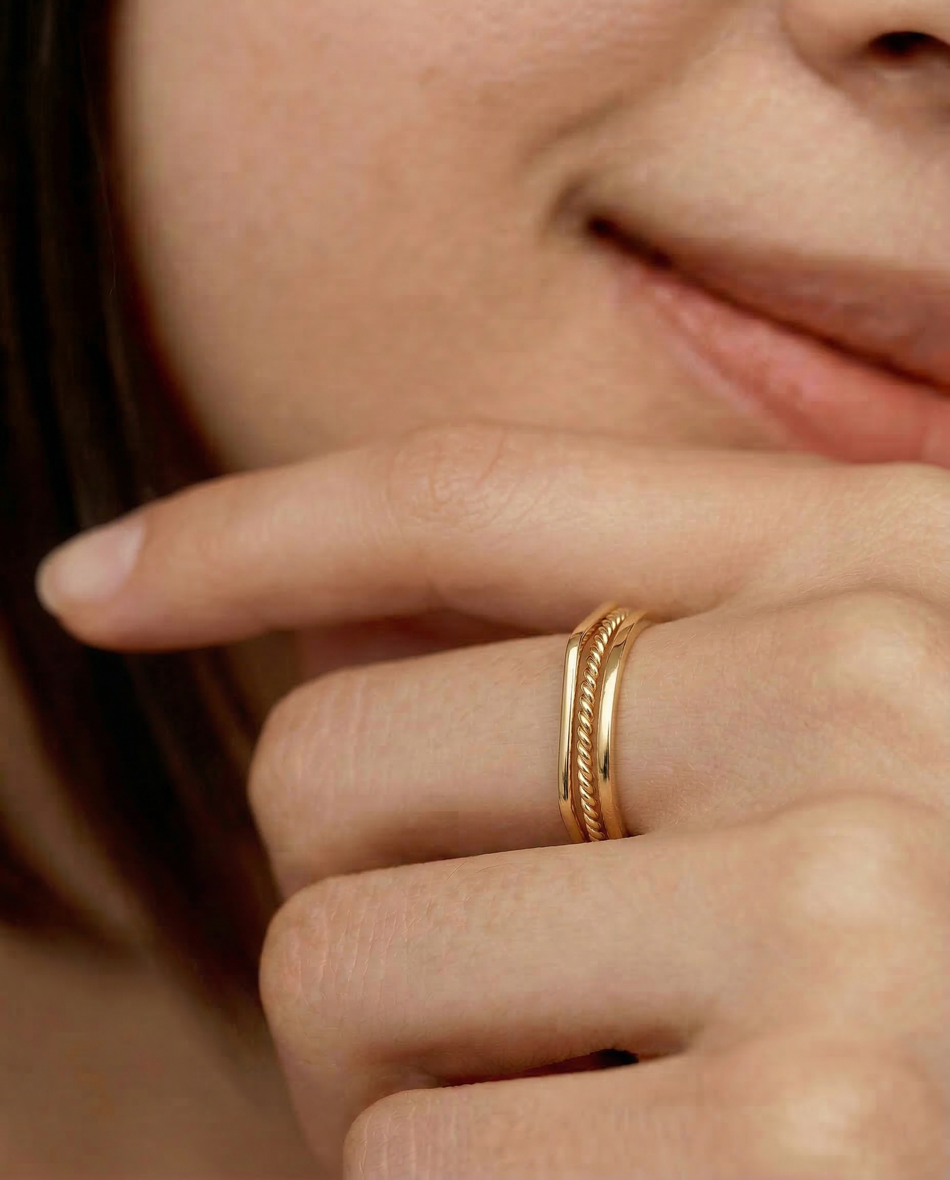 closeup shot of a model wearing set of 3 stacking rings