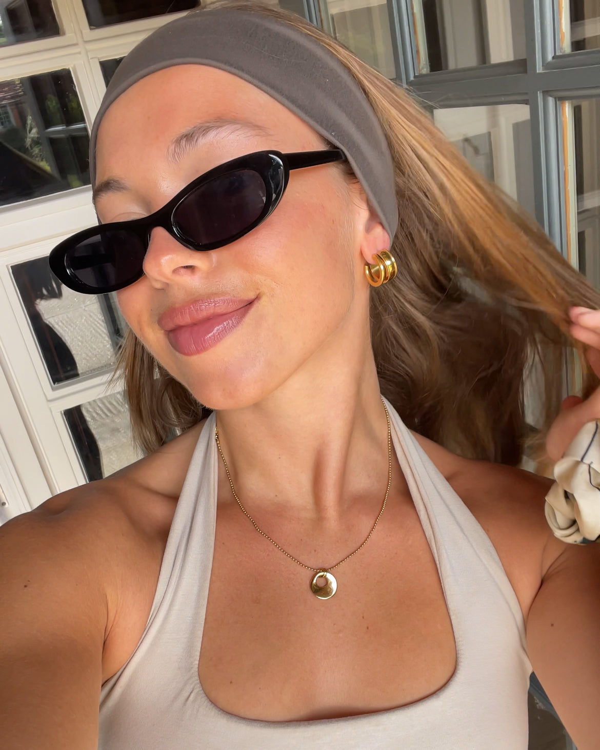 customer woman wearing delphi necklace ugc