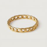 A gold-plated ring with a chain-inspired design, displaying a sleek, polished surface.