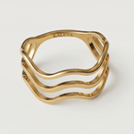 A gold-plated ring with a wave design open band, showing four curved bands that create a sense of lightness and movement.