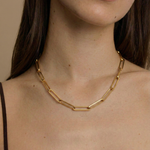 model wearing a gold paperclip chain necklace