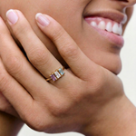 model smiling while wearing a cocktail ring