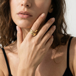 female model wearing a wavy adjustable gold plated ring