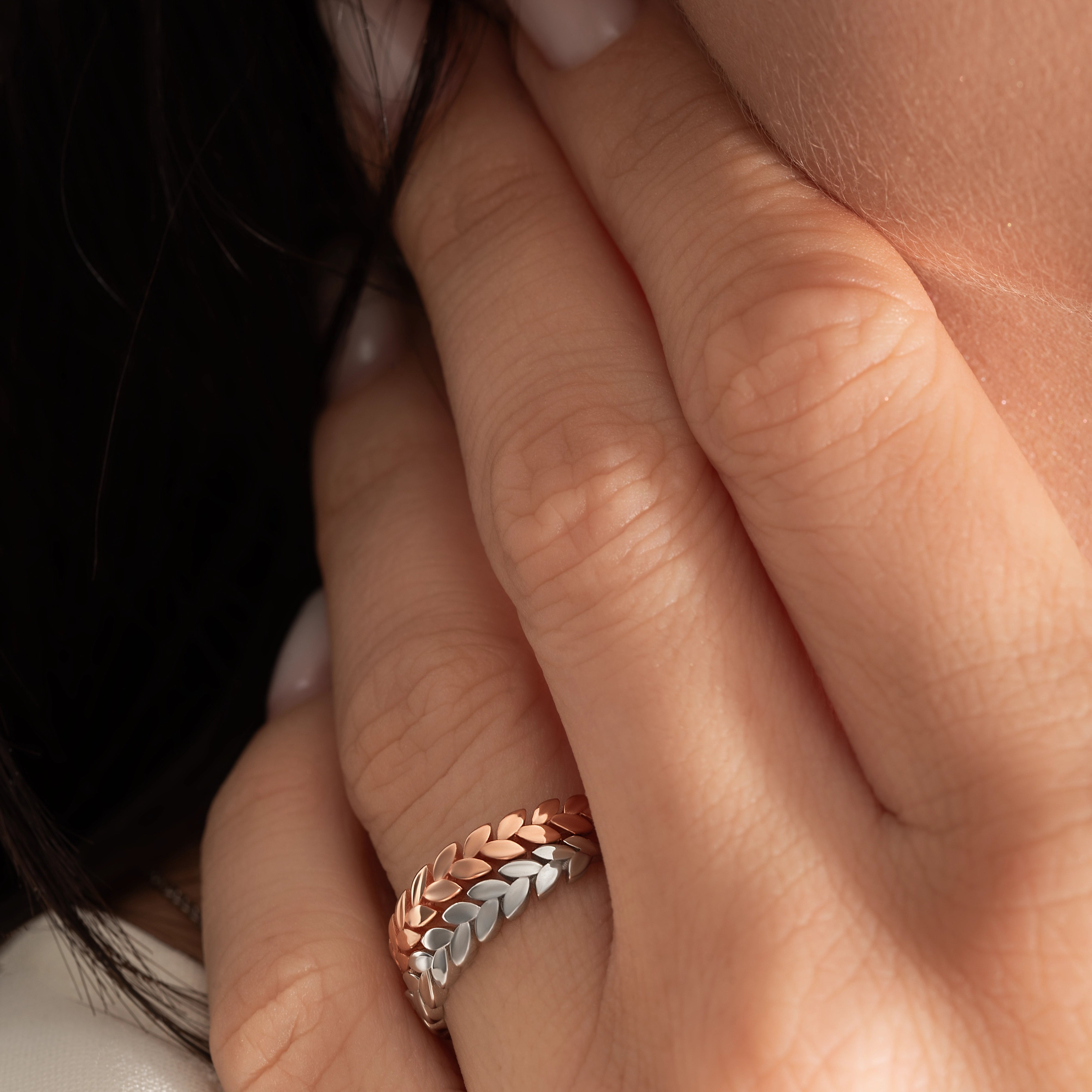 close up of a model wearing the zaria ring from Kaleya Studio in sterling silver and rose
