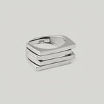video of a silver ring with a bold, architectural design consisting of layered silver plates.