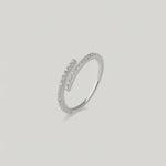 rotating video of a silver ring with an open spiral design adorned with sparkling cubic zirconia stones