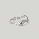 rotating video of a sleek silver ring with an undulating design, crafted from sterling silver
