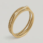 video of three gold-plated stainless steel stacking rings with a twisted design, polished finish