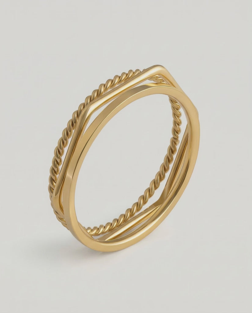 video of three gold-plated stainless steel stacking rings with a twisted design, polished finish