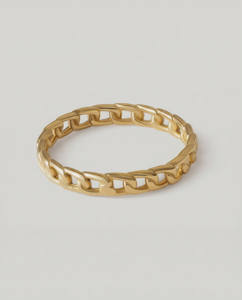 360 rotating video of a gold-plated ring with a chain-inspired design, displaying a sleek, polished surface.