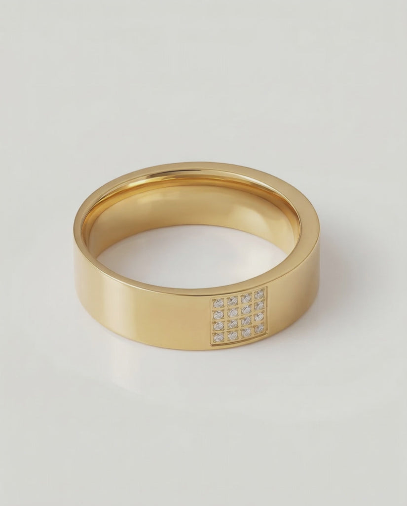 rotating video of a gold-plated stainless steel ring with a polished finish and a section of the band adorned with pavé-set stones.
