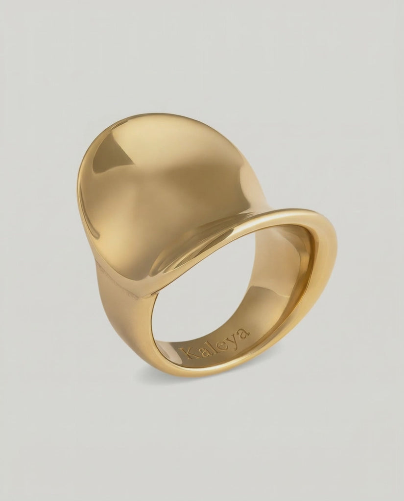 video showing a gold-plated stainless steel ring with a smooth, shiny finish and a substantial silhouette
