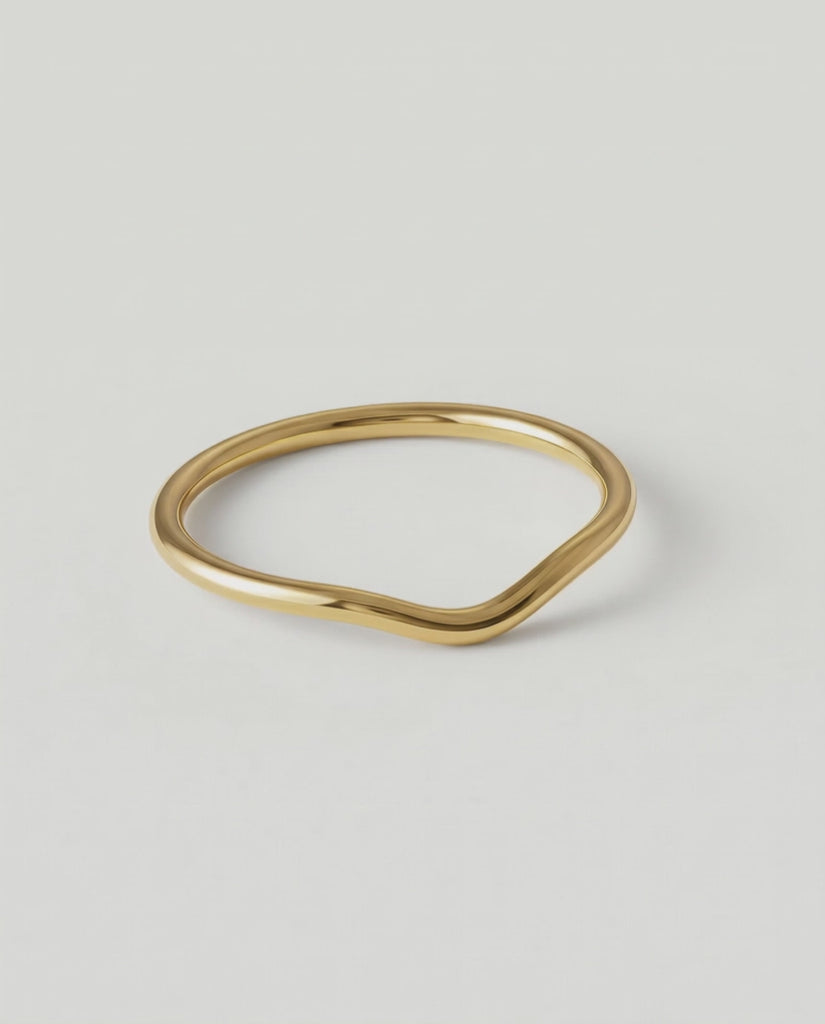 360 video of a gold-plated metal ring with a fluid, asymmetrical wave design