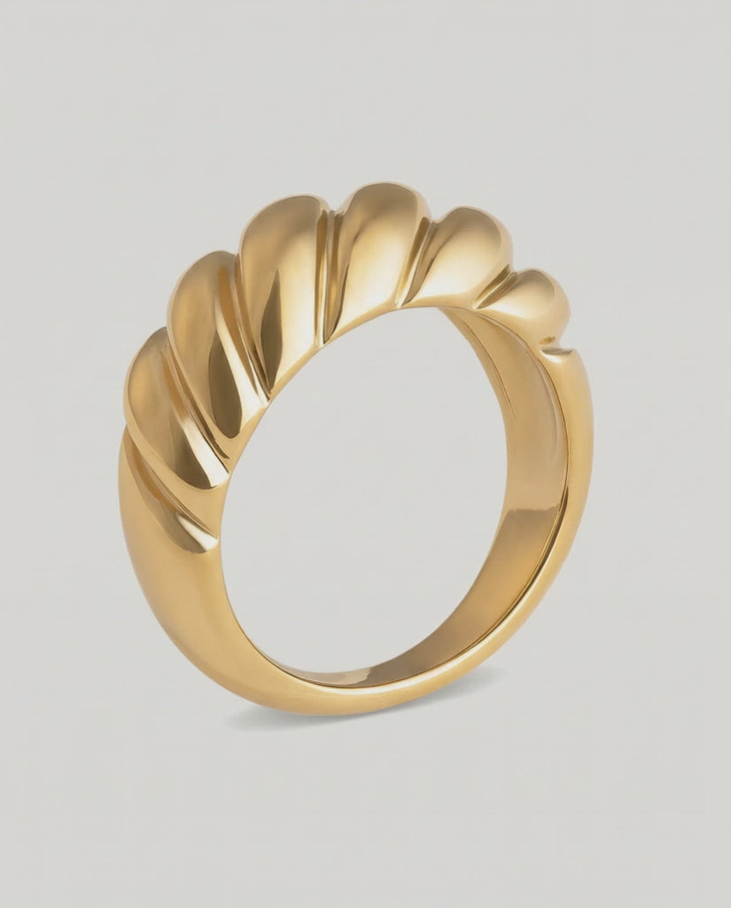 rotating video of a gold-plated stainless steel ring with a textured, wave-like design