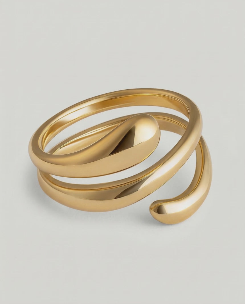360 video of a gold-plated stainless steel ring with an architectural, coiled design