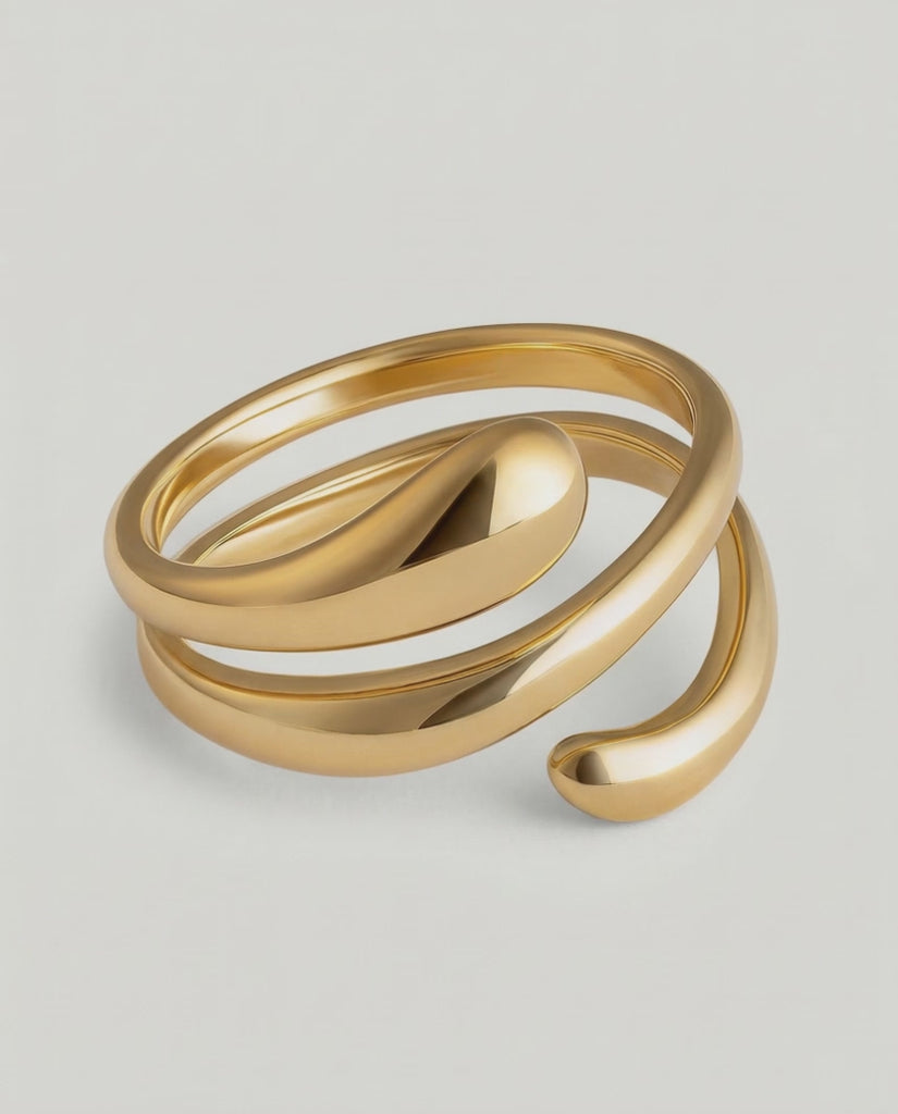 360 video of a gold-plated stainless steel ring with an architectural, coiled design