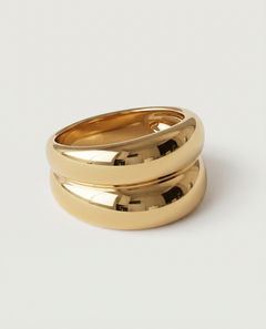 A gold-plated ring with a smooth, curved design 