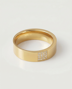 A gold-plated stainless steel ring with a polished finish and a section of the band adorned with pavé-set stones.